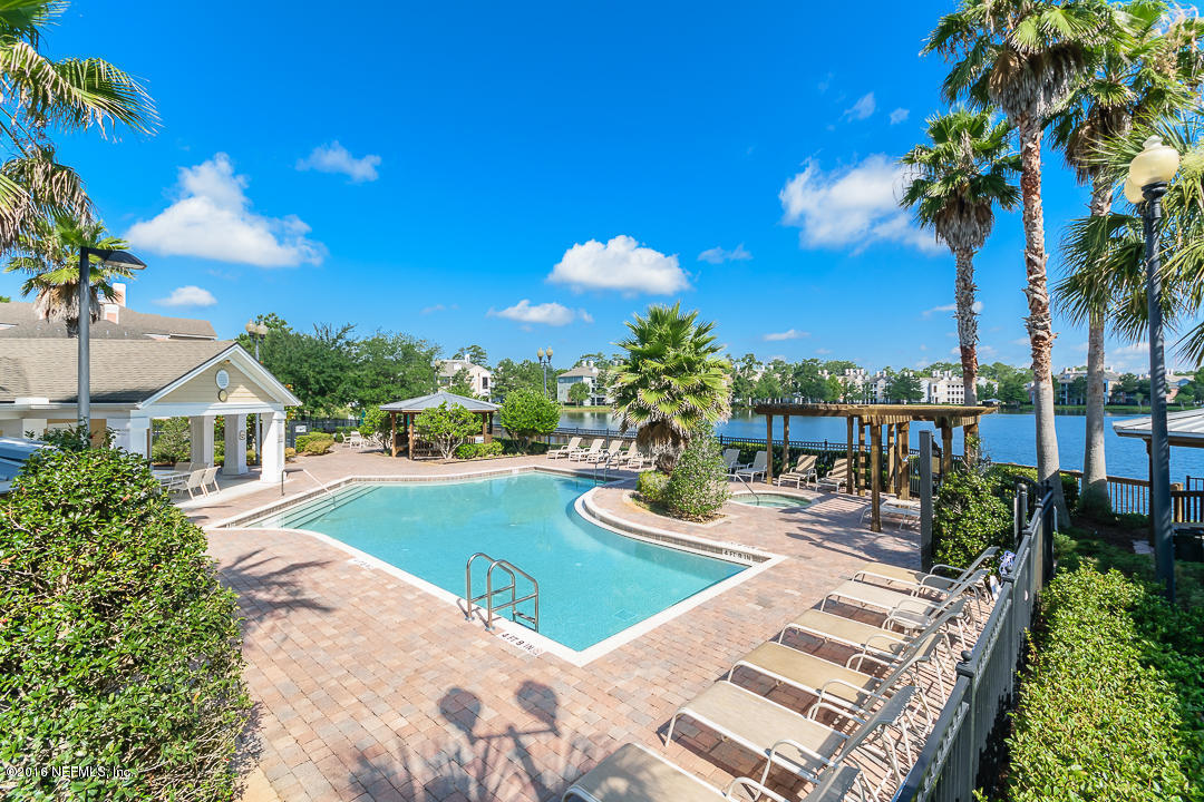 8550 Touchton Road, Unit 636 Jacksonville, FL 32216 - Photo 5 of 11 a view of a house with a yard