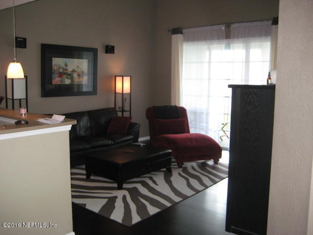 8550 Touchton Road, Unit 636 Jacksonville, FL 32216 - Photo 8 of 11 a living room with furniture and a window