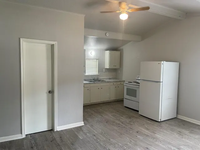 a kitchen with a refrigerator a sink and dishwasher