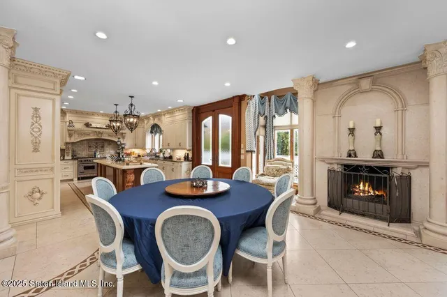 a living room with stainless steel appliances kitchen island granite countertop furniture and a kitchen view