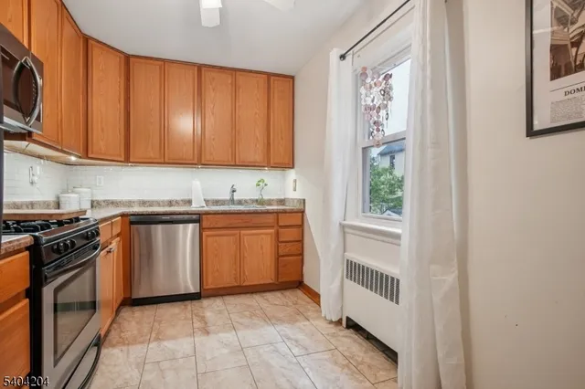 a kitchen with a stove a sink and a microwave