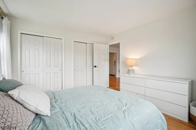 a spacious bedroom with a bed and a closet