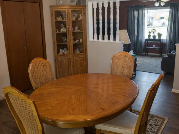 a view of a dining room with furniture and window