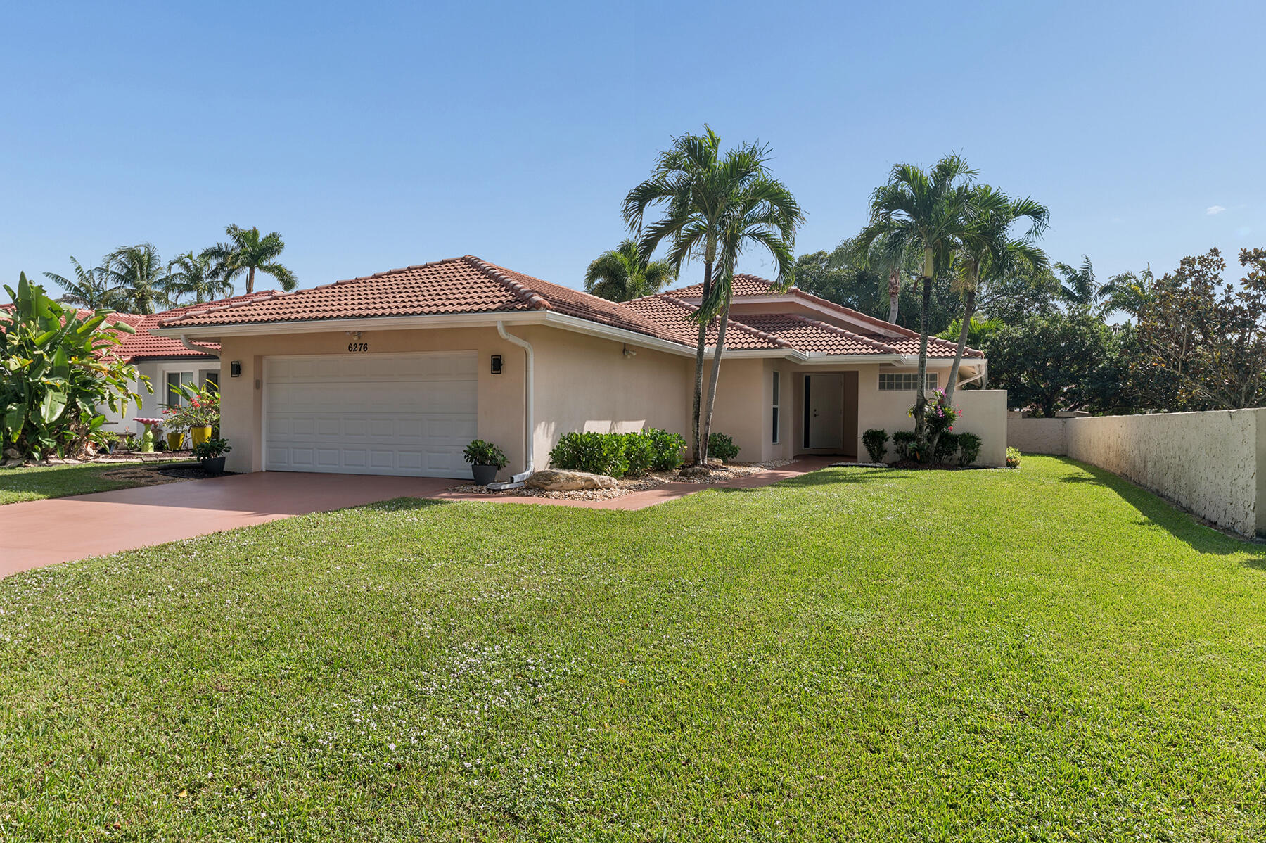 a front view of house with yard and outdoor seating