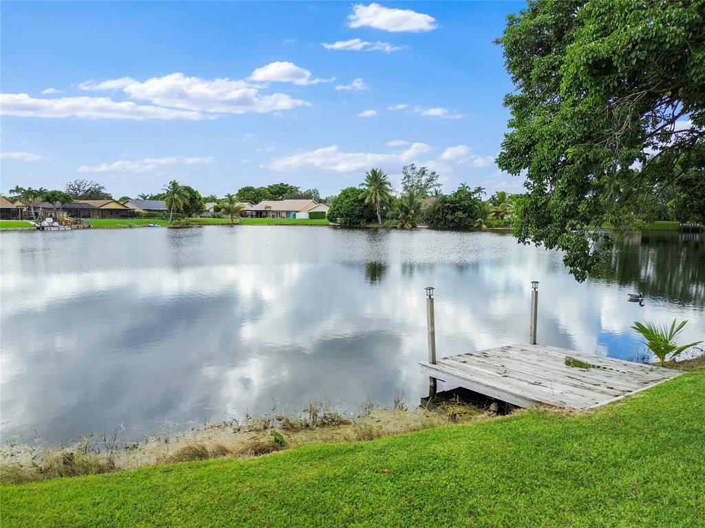 9477 Burlington Place Boca Raton, FL 33434 - Photo 25 of 40 a view of a lake with a yard