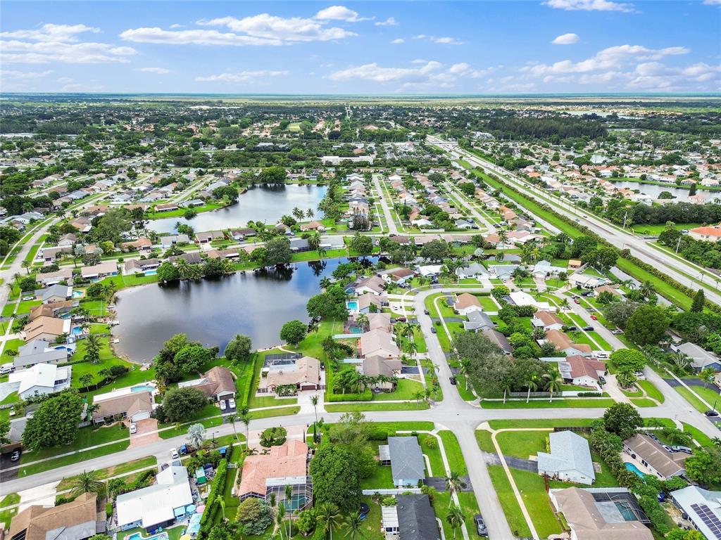 9477 Burlington Place Boca Raton, FL 33434 - Photo 36 of 40 an aerial view of residential houses with outdoor space and lake view