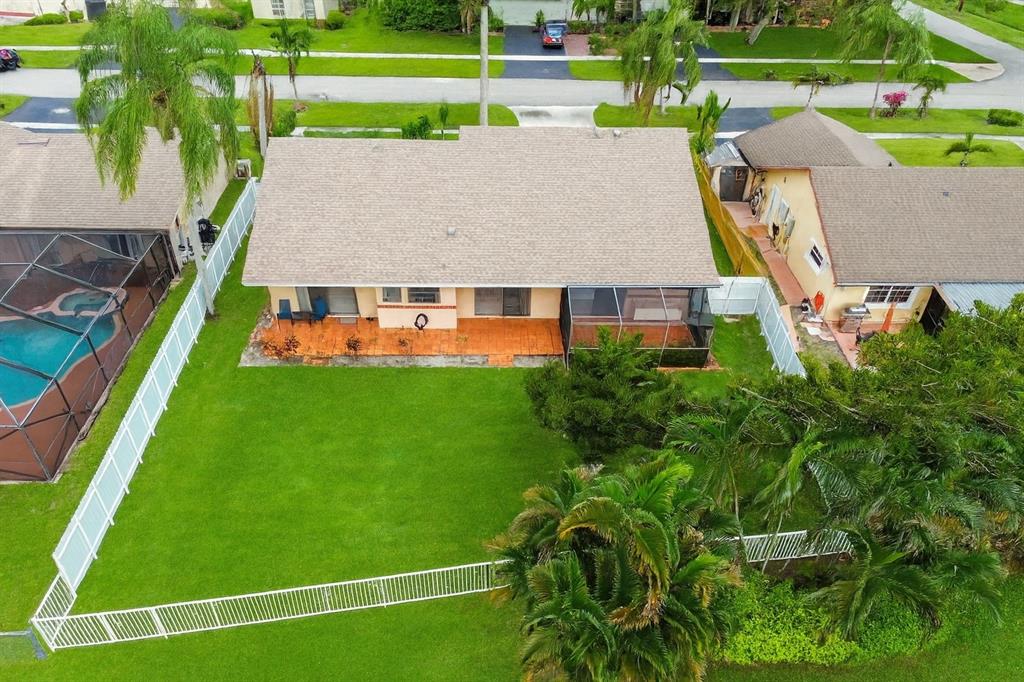 9477 Burlington Place Boca Raton, FL 33434 - Photo 4 of 40 a view of yard with swimming pool and green space