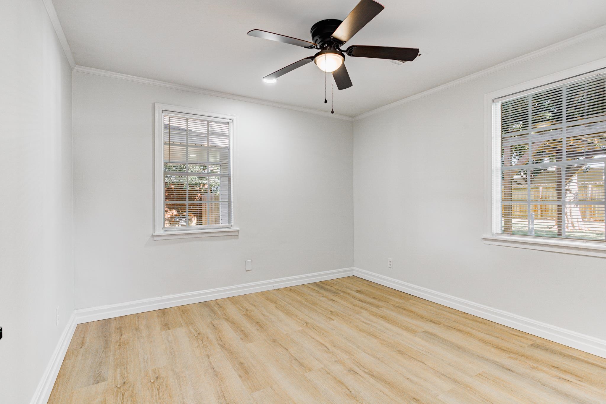 4008 Forrest Drive Memphis, TN 38122 - Photo 14 of 21 a view of empty room with wooden floor and fan