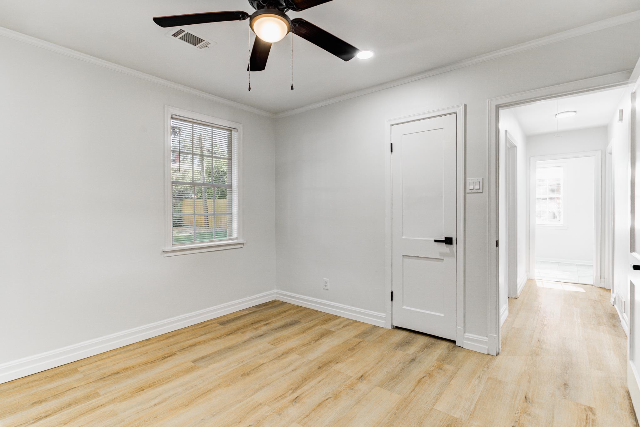 4008 Forrest Drive Memphis, TN 38122 - Photo 15 of 21 a view of empty room with wooden floor and fan