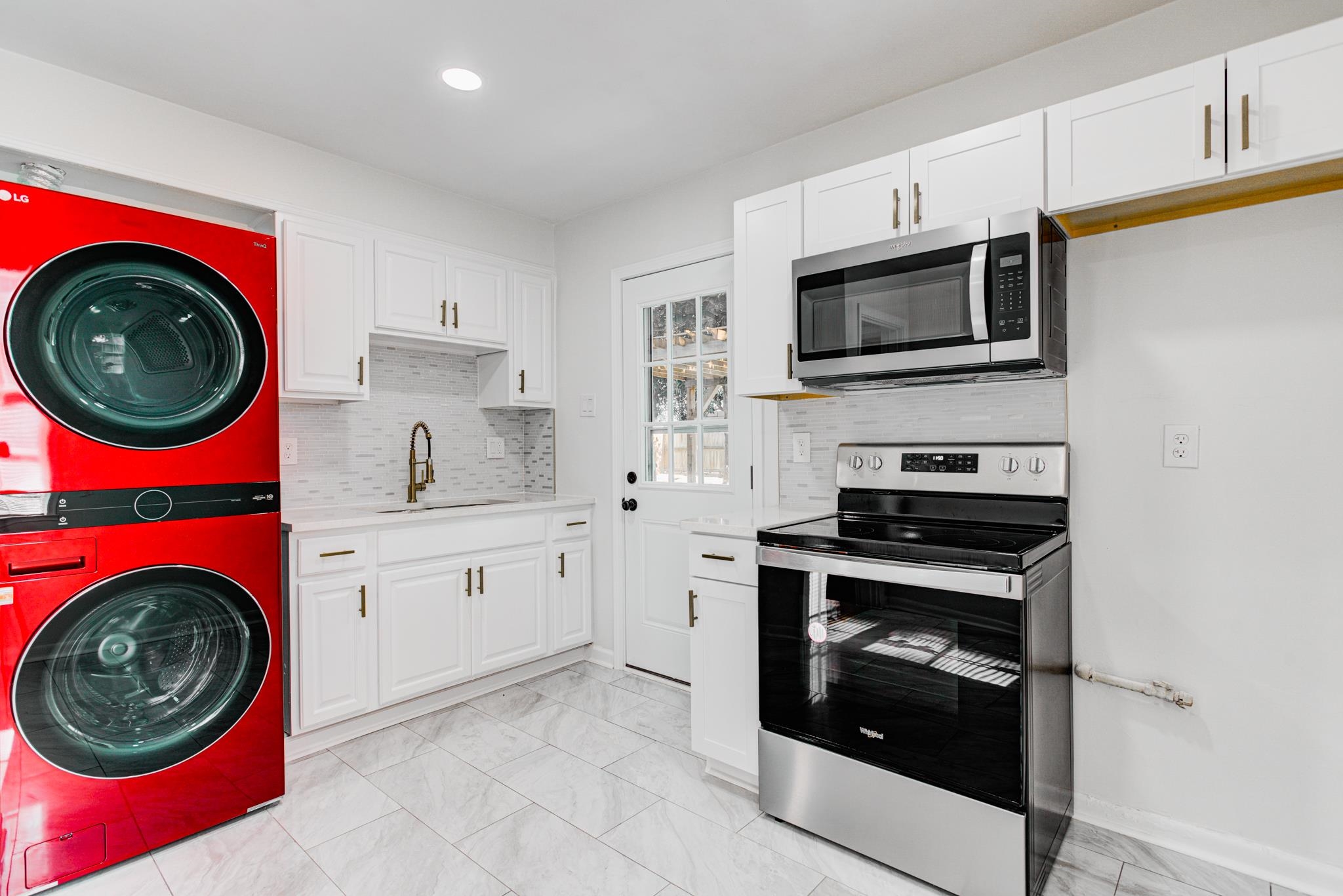 4008 Forrest Drive Memphis, TN 38122 - Photo 16 of 21 a kitchen with a stove top oven and cabinets