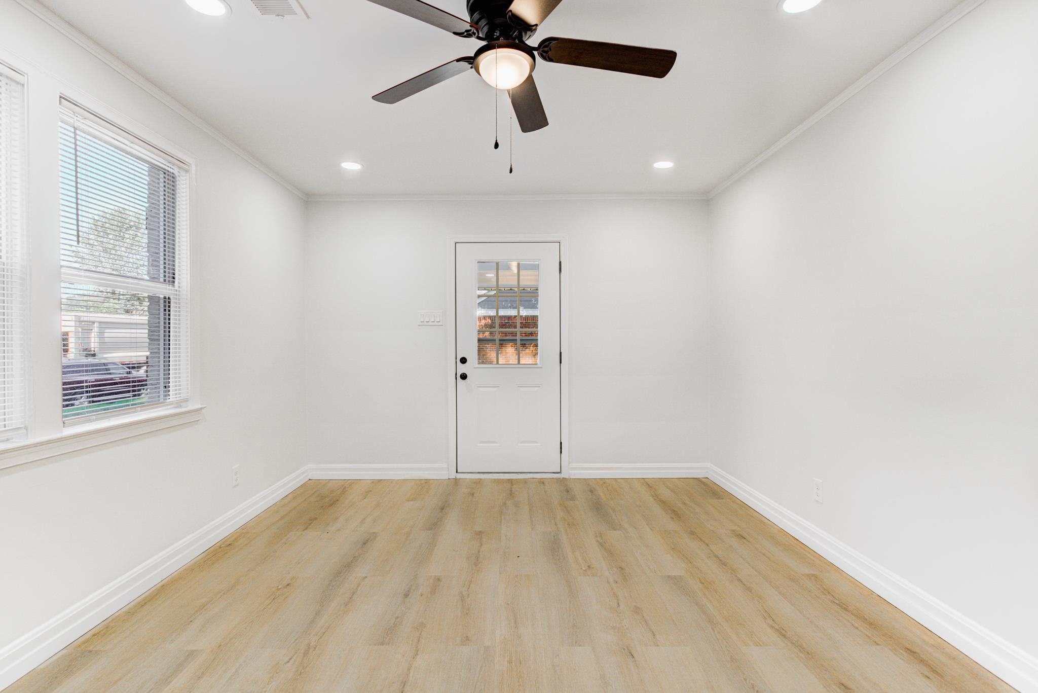 4008 Forrest Drive Memphis, TN 38122 - Photo 5 of 21 a view of an empty room with window and wooden floor
