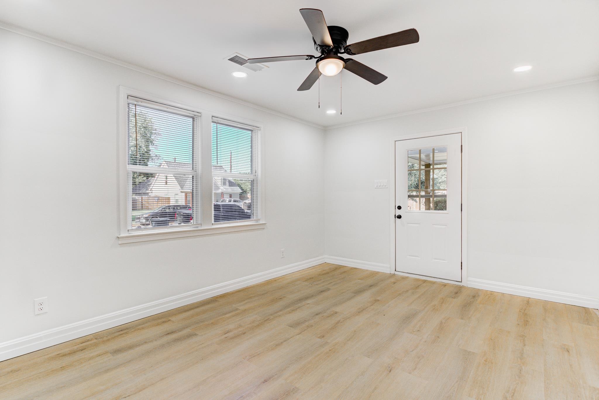 4008 Forrest Drive Memphis, TN 38122 - Photo 6 of 21 a view of a big room with wooden floor and windows