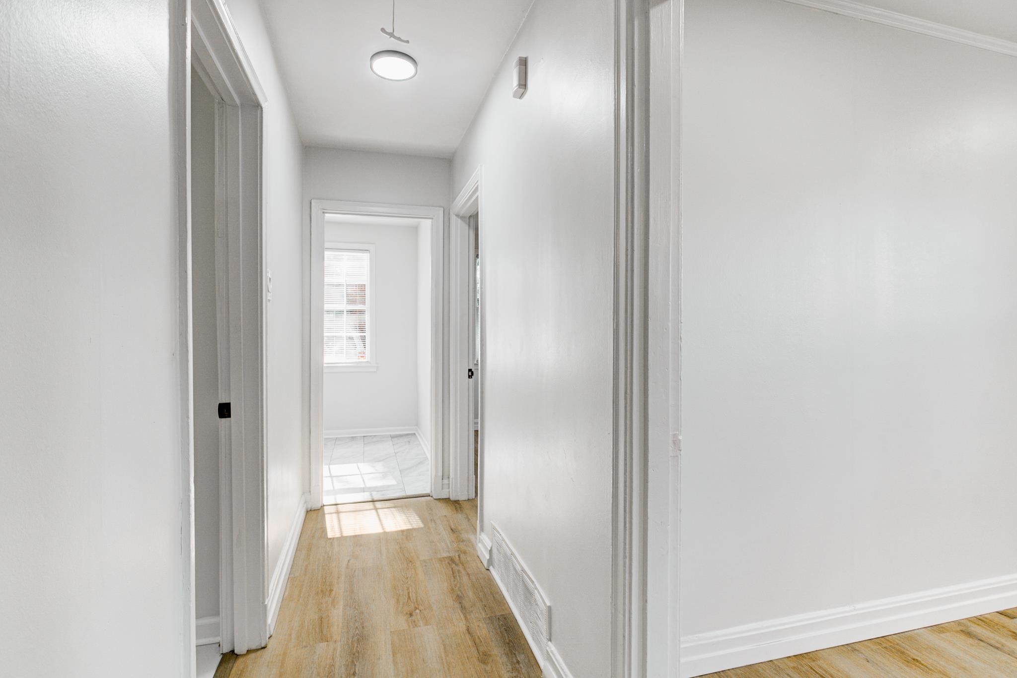 4008 Forrest Drive Memphis, TN 38122 - Photo 8 of 21 a view of a hallway with wooden floor