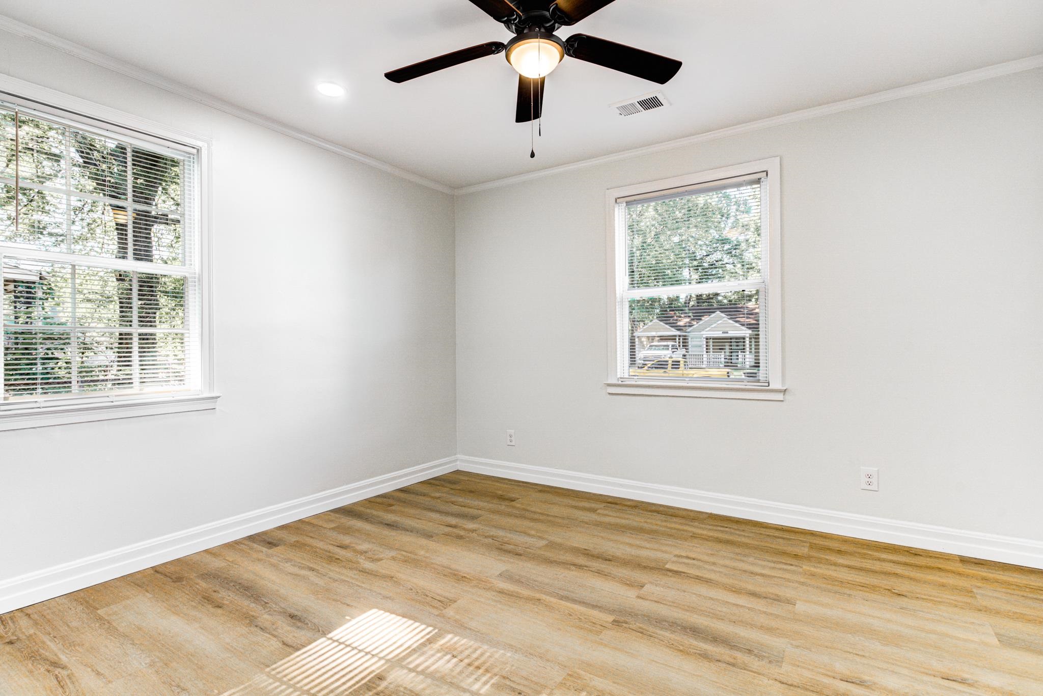 4008 Forrest Drive Memphis, TN 38122 - Photo 9 of 21 a view of a bedroom with wooden floor and windows