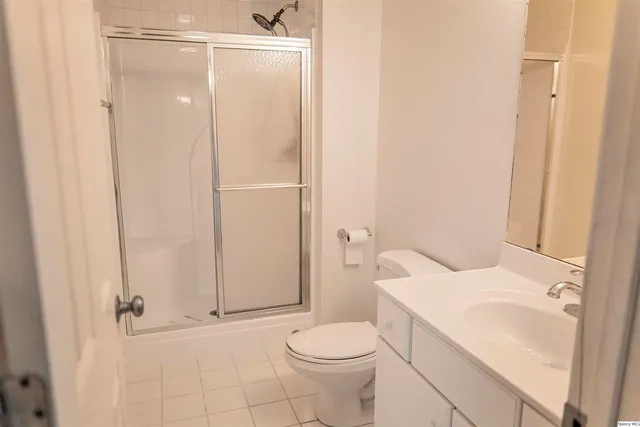 a view of a wooden deck with large trees