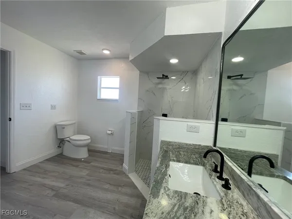 a bathroom with a sink and a toilet