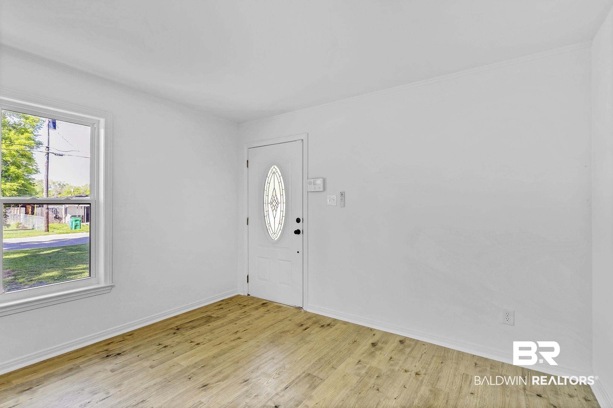 203 Anderson Road Saraland, AL 36571 - Photo 4 of 48 Entrance foyer with baseboards and light wood finished floors