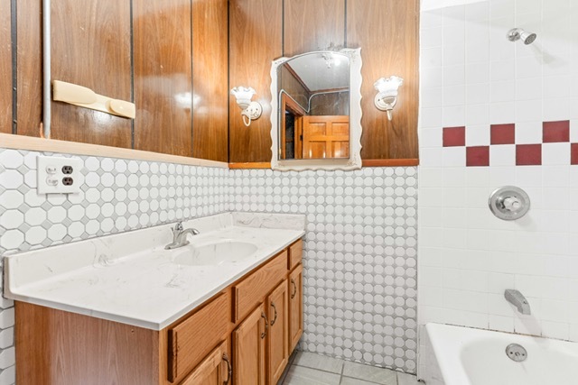 3047 South Broad Street Chicago, IL 60608 - Photo 11 of 25 a bathroom with a sink a toilet and shower