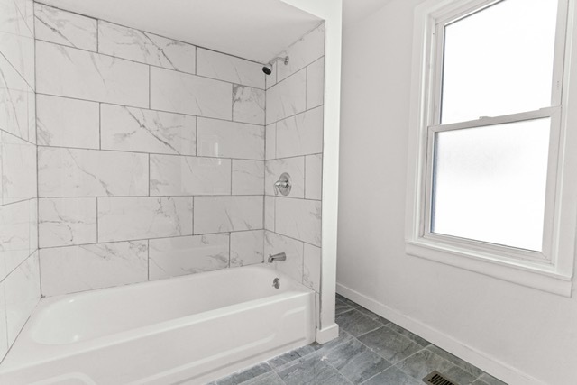 3047 South Broad Street Chicago, IL 60608 - Photo 23 of 25 a bathroom with a bathtub and a shower