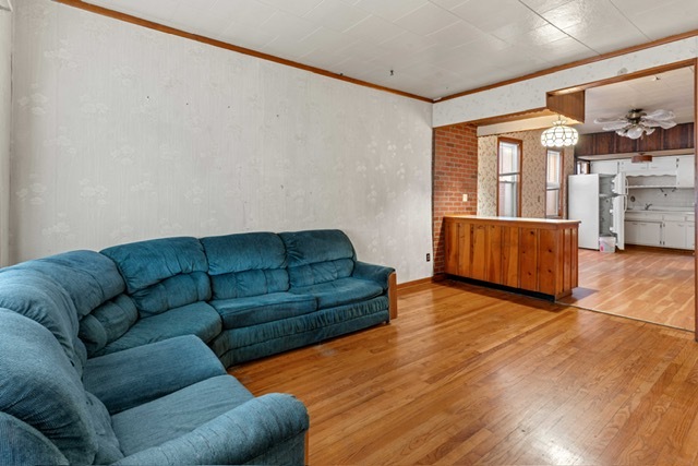 3047 South Broad Street Chicago, IL 60608 - Photo 3 of 25 a living room with furniture and a large window