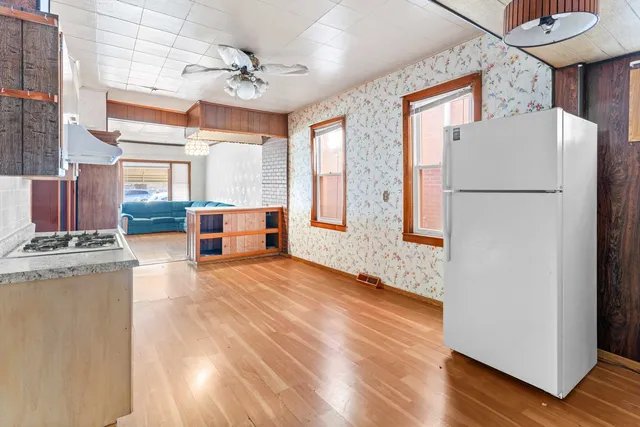 a view of kitchen with furniture and wooden floor