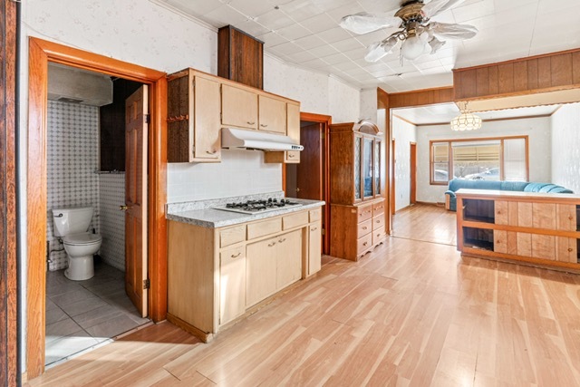 3047 South Broad Street Chicago, IL 60608 - Photo 9 of 25 a kitchen with stainless steel appliances a stove refrigerator and cabinets