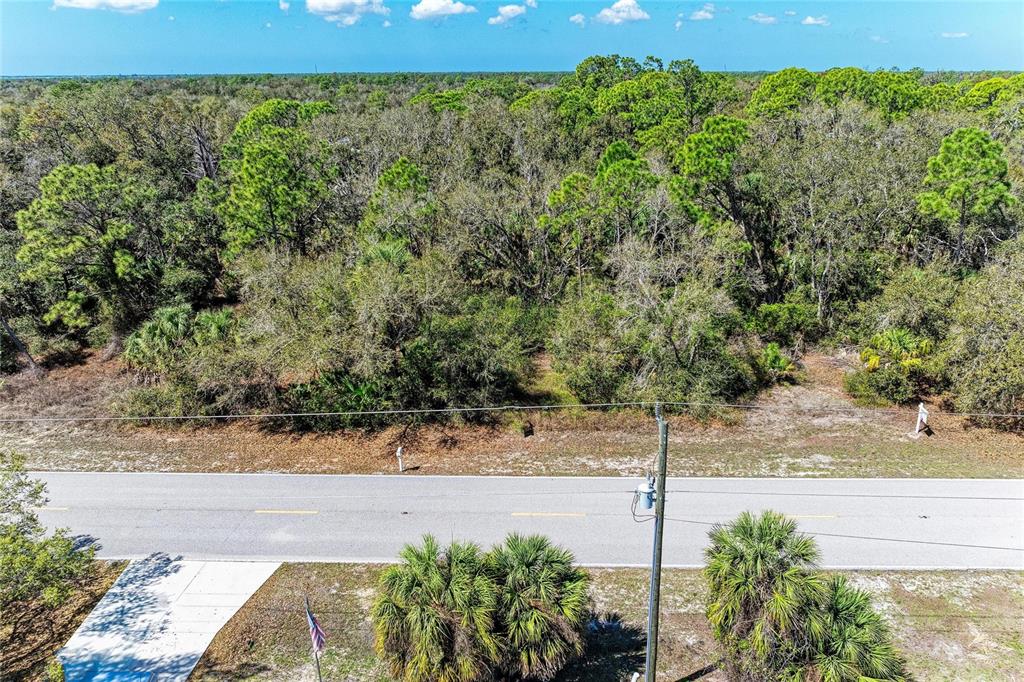 3067 Como Street Port Charlotte, FL 33948 - Photo 6 of 15 a view of a pathway with a bench