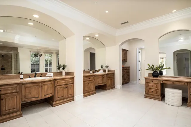 a large bathroom with a large tub and sink
