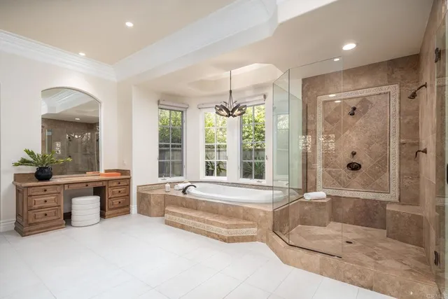 a spacious bathroom with a tub shower and sink