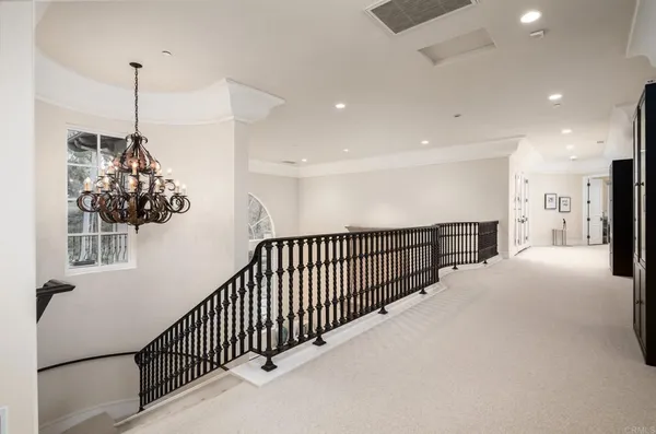 a view of a hallway with a chandelier