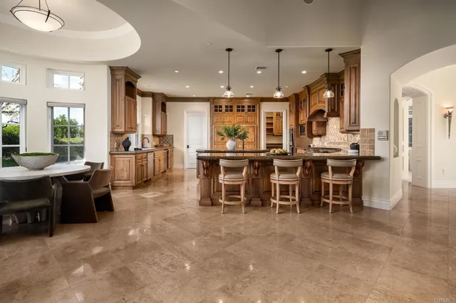 a view of a dining area with furniture window and a kitchen