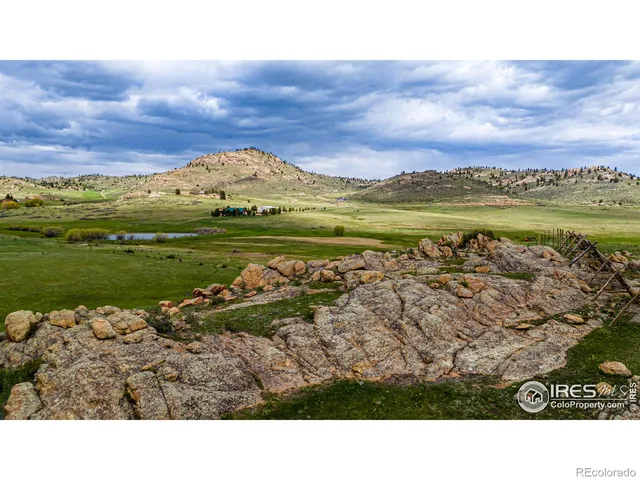 a view of a field with an ocean