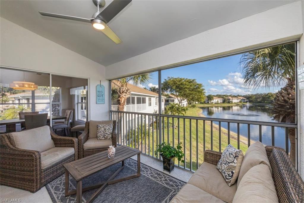 866 Carrick Bend Circle, Unit 201 Naples, FL 34110 - Photo 15 of 35 a balcony with furniture and a potted plant