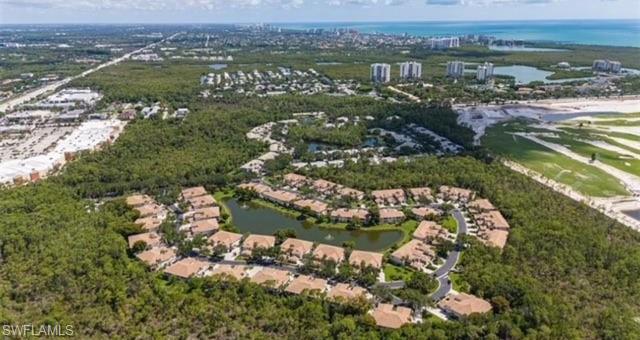 866 Carrick Bend Circle, Unit 201 Naples, FL 34110 - Photo 32 of 35 an aerial view of residential houses with outdoor space