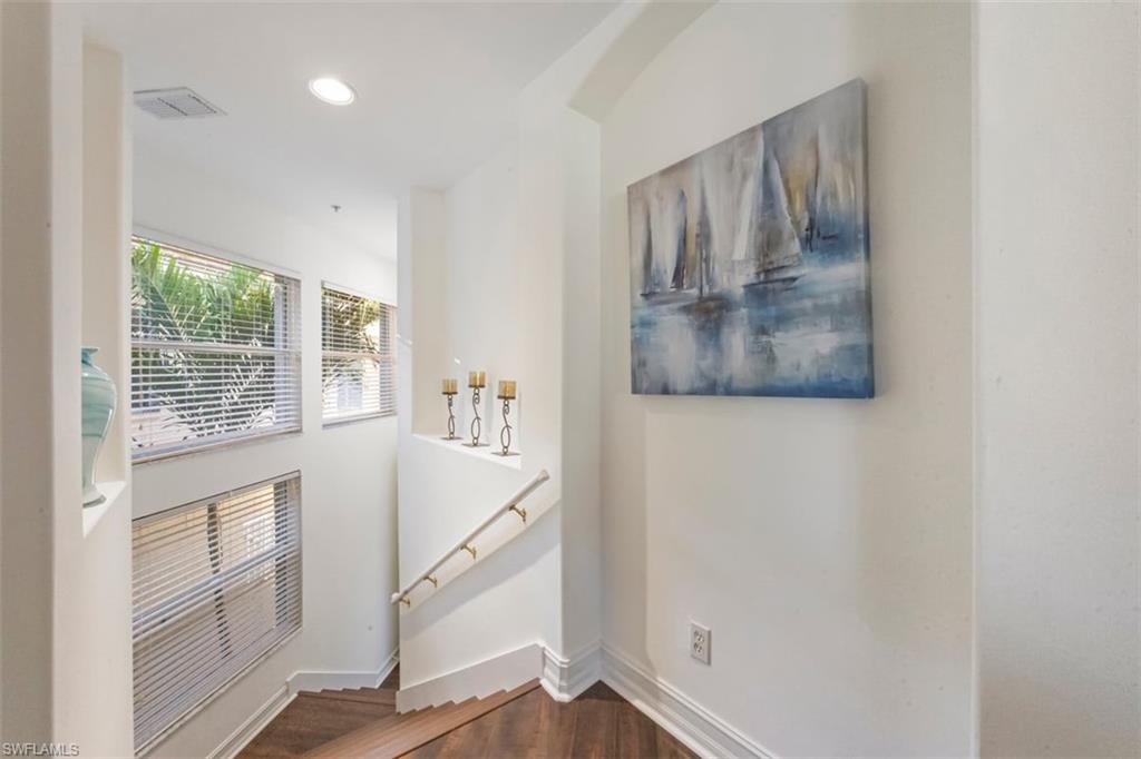 866 Carrick Bend Circle, Unit 201 Naples, FL 34110 - Photo 6 of 35 a view of entryway with wooden floor and door