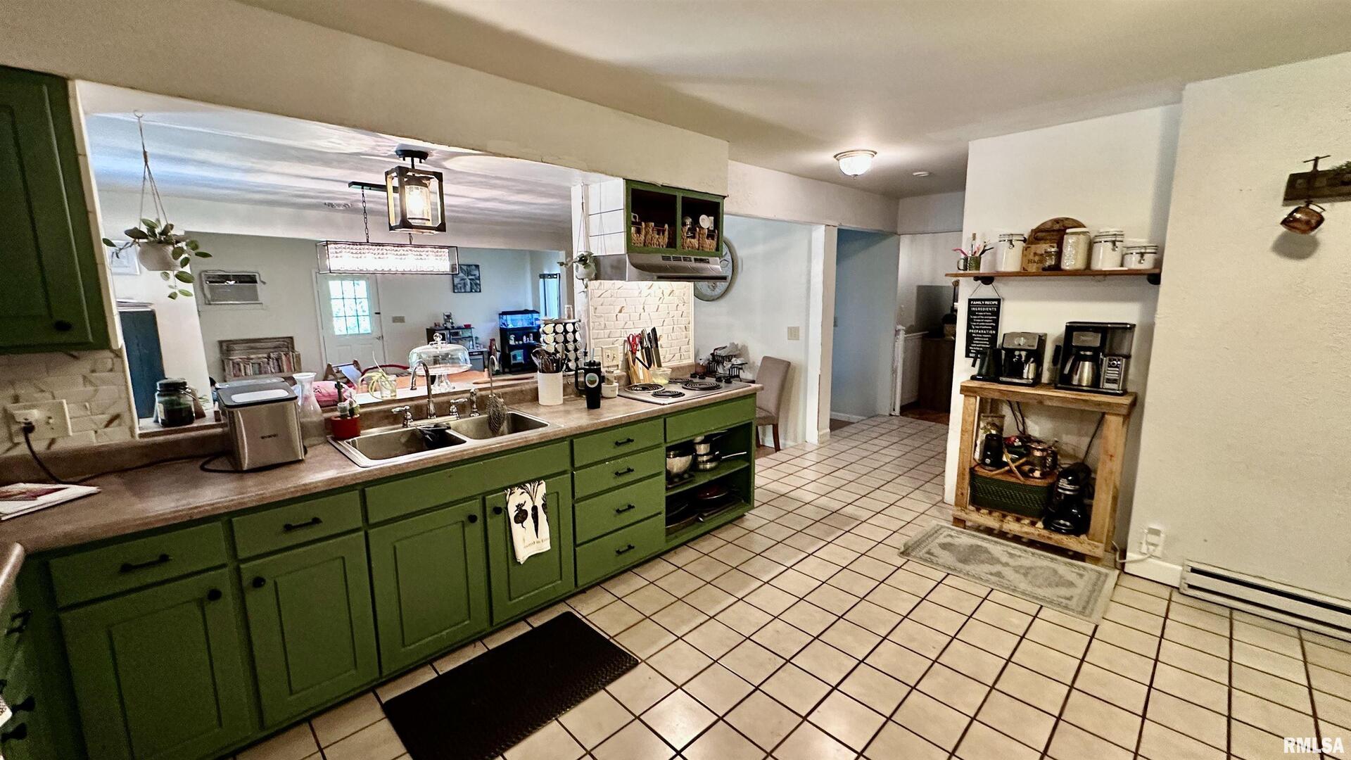 909 North Road West Frankfort, IL 62896 - Photo 16 of 28 a kitchen with stainless steel appliances kitchen island granite countertop a refrigerator and a sink