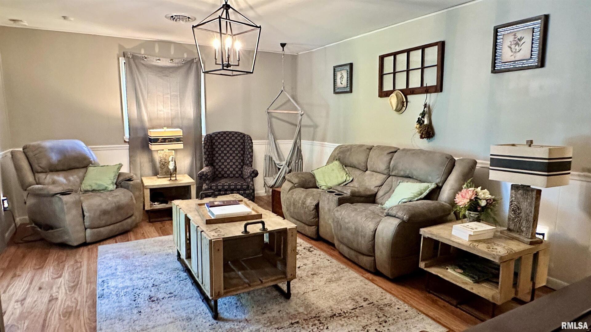 909 North Road West Frankfort, IL 62896 - Photo 17 of 28 a living room with furniture and a chandelier