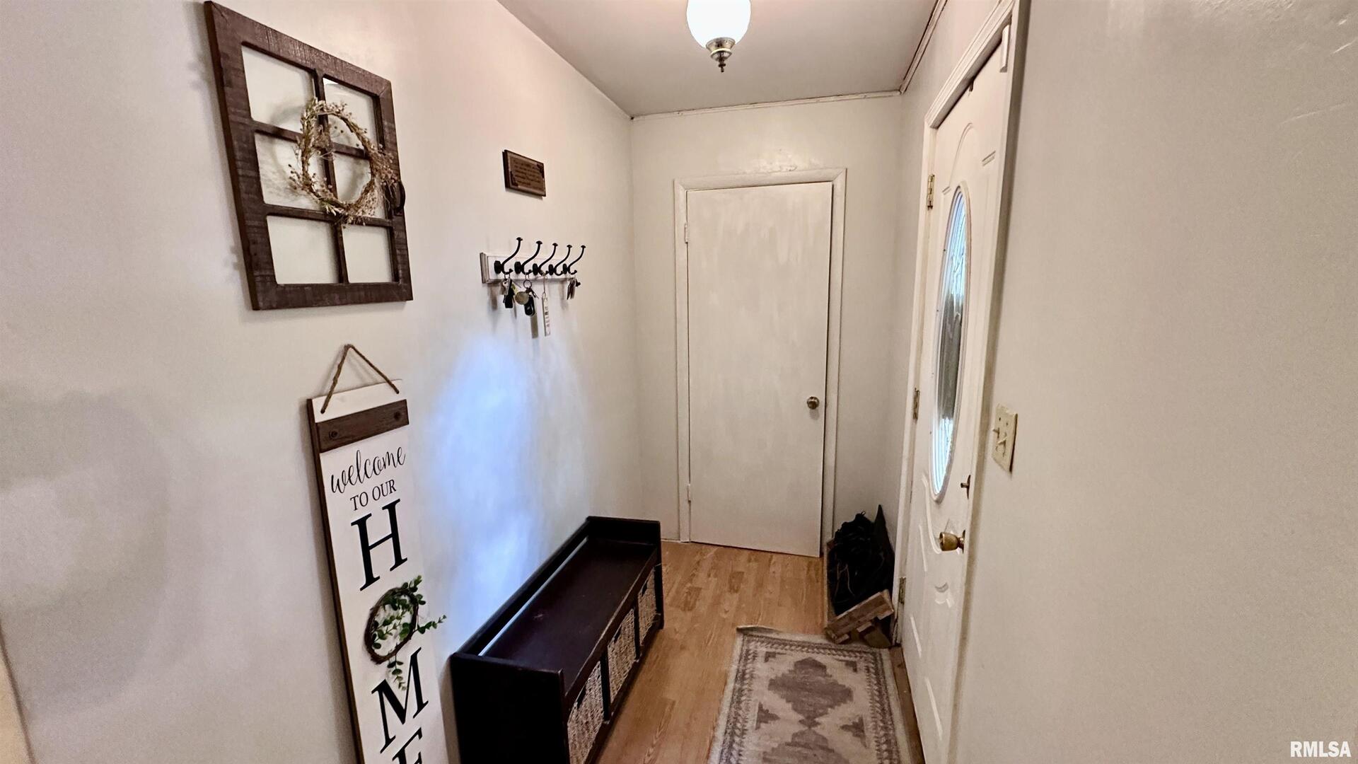 909 North Road West Frankfort, IL 62896 - Photo 23 of 28 a view of a hallway with paintings on the wall