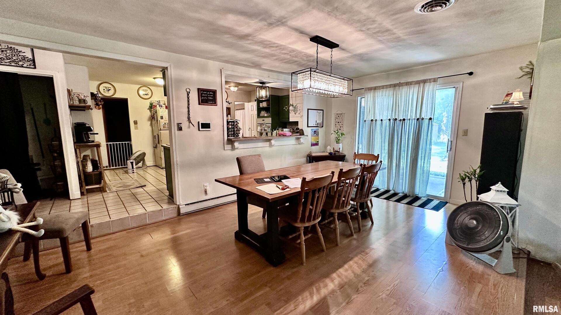 909 North Road West Frankfort, IL 62896 - Photo 9 of 28 a view of a dining room with furniture window and wooden floor