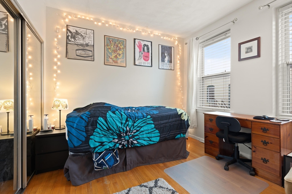 88 Gordon Street, Unit 402 Boston, MA 02135 - Photo 10 of 15 a living room with furniture and a window