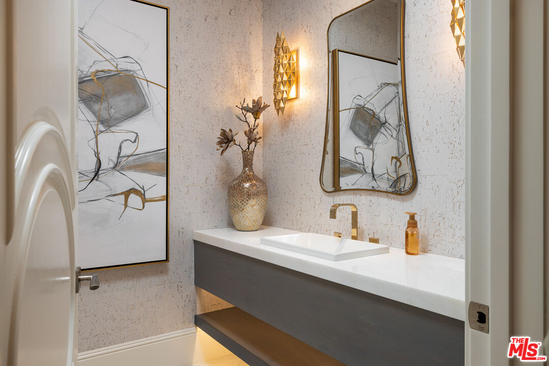 28 Tide Watch Newport Coast, CA 92657 - Photo 11 of 23 a bathroom with a sink and mirror