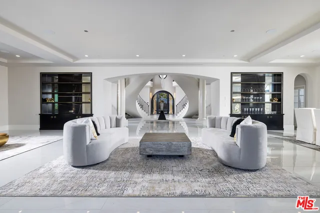 a living room with furniture rug and window