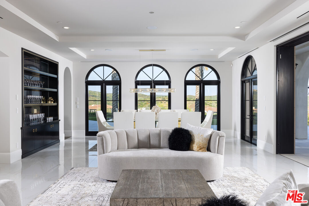 28 Tide Watch Newport Coast, CA 92657 - Photo 8 of 23 a large living room with windows and wooden floor