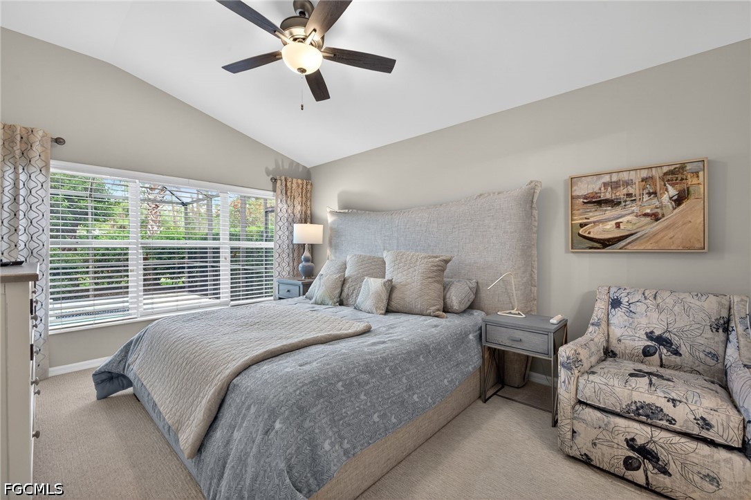 10082 Oakhurst Way Fort Myers, FL 33913 - Photo 15 of 50 a bedroom with a large bed and a window