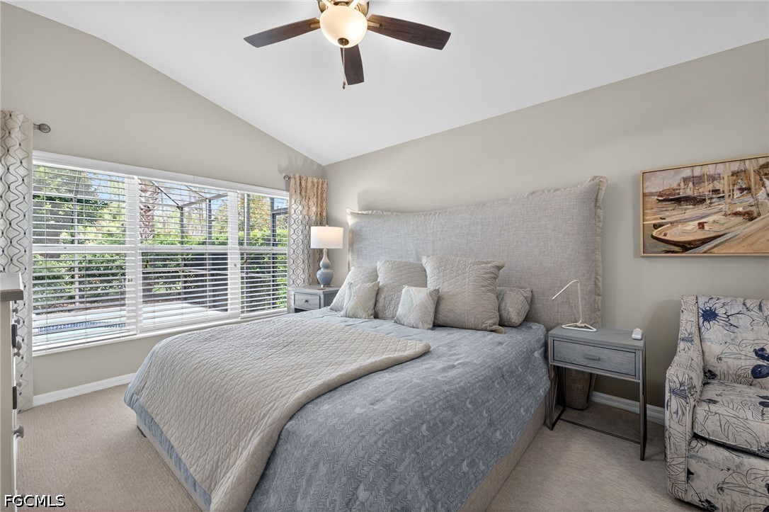10082 Oakhurst Way Fort Myers, FL 33913 - Photo 17 of 50 a bedroom with a large bed and a window