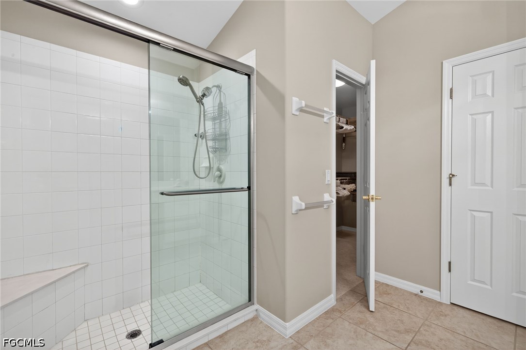 10082 Oakhurst Way Fort Myers, FL 33913 - Photo 20 of 50 a bathroom with a glass shower door