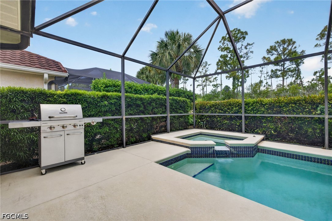 10082 Oakhurst Way Fort Myers, FL 33913 - Photo 30 of 50 a view of a chair and tables in the backyard