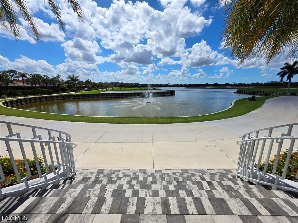 10082 Oakhurst Way Fort Myers, FL 33913 - Photo 44 of 50 a view of a swimming pool with a yard