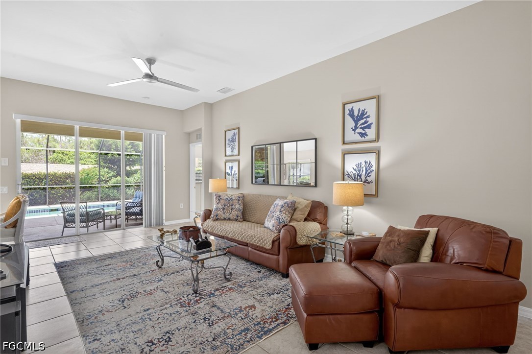 10082 Oakhurst Way Fort Myers, FL 33913 - Photo 6 of 50 a living room with furniture and a wooden floor
