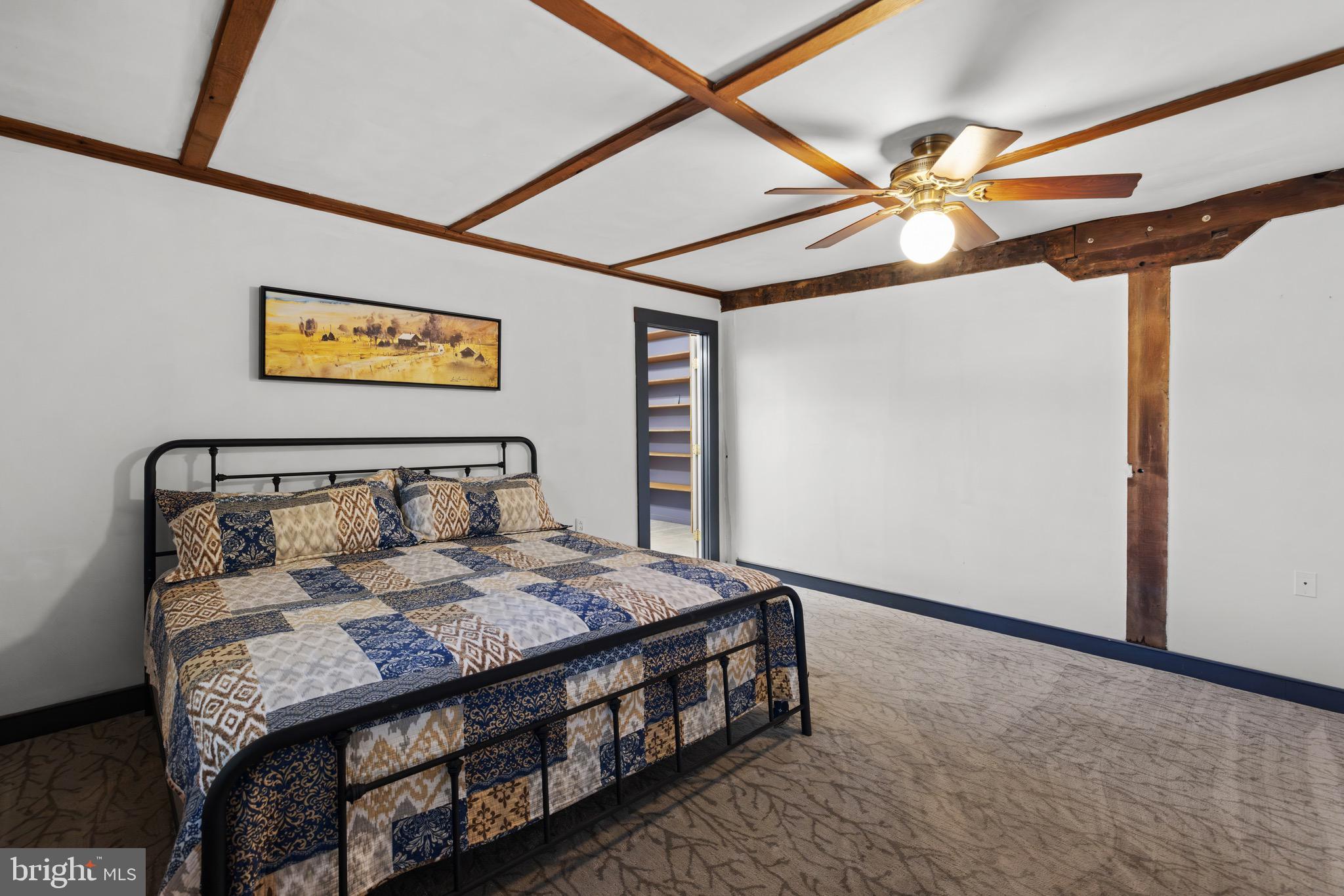 719 Mission Road Harpers Ferry, WV 25425 - Photo 26 of 37 a bedroom with a bed and a chandelier